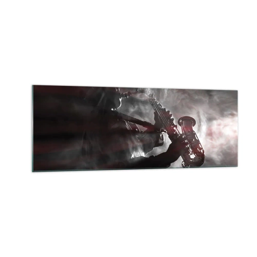 Obraz na szkle - Saksofonista w dymie na scenie w klimatycznej czerni i czerwieni - 140x50cm - W oparach jazzu - Nowoczesna dekoracja ścienna do salonu i sypialni ARTTOR