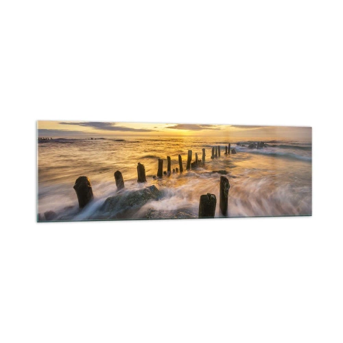 Obraz na szkle - Zachód słońca nad morzem z pozostałościami starego molo - 160x50cm - Surowe piękno Bałtyku - Nowoczesna dekoracja ścienna do salonu i sypialni ARTTOR