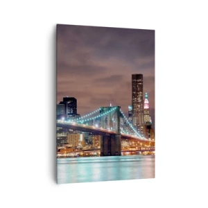 Obraz na płótnie - Most podświetlony nocą na tle nowoczesnej panoramy miasta - 70x100cm - Światła wielkiego miasta - Nowoczesna dekoracja ścienna do salonu i sypialni ARTTOR