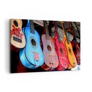 Obraz na płótnie - Kolorowe gitary akustyczne powieszone w rzędzie na wystawie - 120x80cm - Latynoskie klimaty - Nowoczesna dekoracja ścienna do salonu, kuchni i sypialni ARTTOR