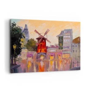 Obraz na płótnie - Czerwony wiatrak Moulin Rouge otoczony miejskim pejzażem - 100x70cm - Paryskie ikony – Moulin Rouge - Nowoczesna dekoracja ścienna do salonu, kuchni i sypialni ARTTOR