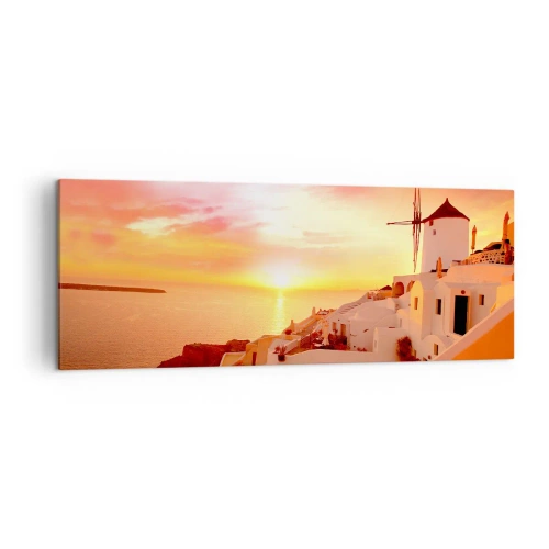 Obraz na płótnie - Santorini o zachodzie słońca z wiatrakiem - 140x50cm - Rozpłynąć się w bieli i złocie - Nowoczesna dekoracja ścienna do salonu i sypialni ARTTOR