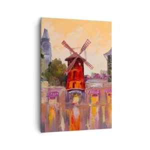 Obraz na płótnie - Czerwony wiatrak Moulin Rouge otoczony miejskim pejzażem - 70x100cm - Paryskie ikony – Moulin Rouge - Nowoczesna dekoracja ścienna do salonu i sypialni ARTTOR
