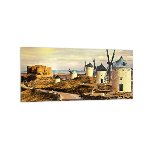 Obraz na szkle - Wiatraki na wzgórzach z historycznym zamkiem w tle - 120x50cm - Zaraz pojawi się Don Kichot - Nowoczesna dekoracja ścienna do salonu i sypialni ARTTOR