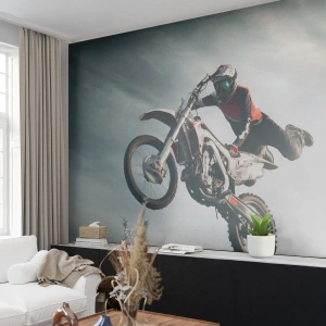 Fototapeta Standard Eco - Motocrossowy skok nad górzystym krajobrazem - 100x70cm - Nie ma zabawy bez ryzyka - Nowoczesna dekoracja ścienna do salonu i sypialni ARTTOR