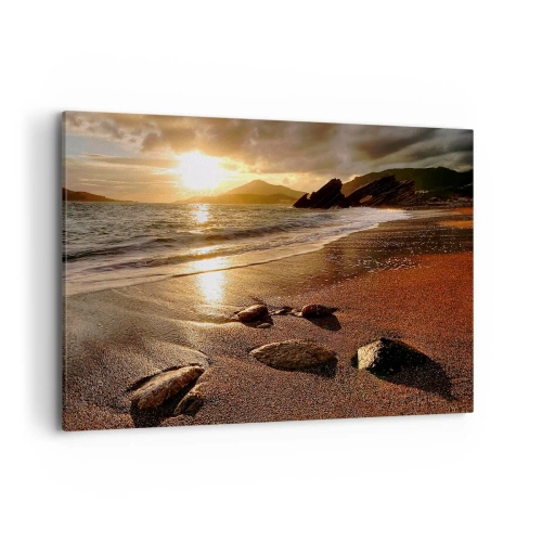 Obraz na płótnie - Plaża o zachodzie słońca z kamieniami na brzegu - 100x70cm - Idź za słońcem ku wzgórzom - Nowoczesna dekoracja ścienna do salonu, kuchni i sypialni ARTTOR