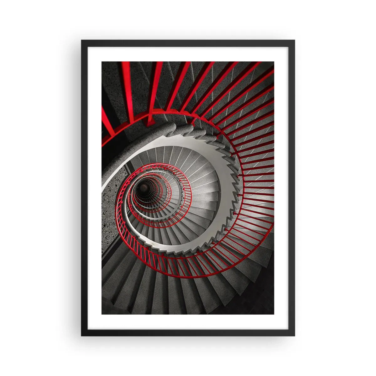 Plakat w czarnej ramie - Kręcone schody w czarno-białej tonacji z czerwonymi poręczami - 50x70cm - Zabawy architektury - Nowoczesna dekoracja ścienna do salonu i sypialni ARTTOR