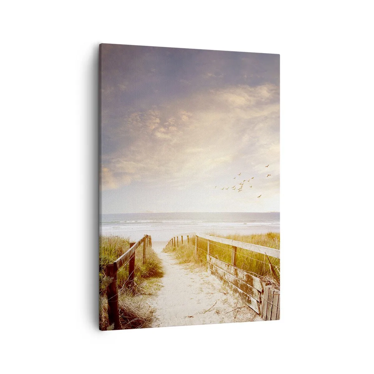 Obraz na płótnie - Przestrzeń spokoju - Drewniana ścieżka prowadząca na plażę o zachodzie słońca - 50x70cm