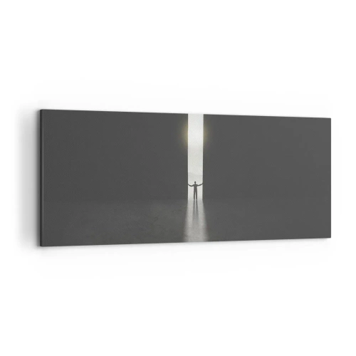 Obraz na płótnie - Człowiek stojący w świetle wąskiej szczeliny w ciemnej przestrzeni - 120x50cm - Krok do jasnej przyszłości - Nowoczesna dekoracja ścienna do salonu i sypialni ARTTOR