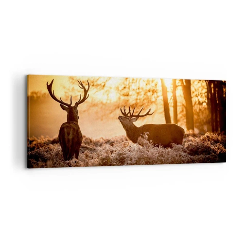 Obraz na płótnie - Dwa jelenie o zachodzie słońca w zimowym krajobrazie - 120x50cm - Marzenie myśliwego - Nowoczesna dekoracja ścienna do salonu i sypialni ARTTOR