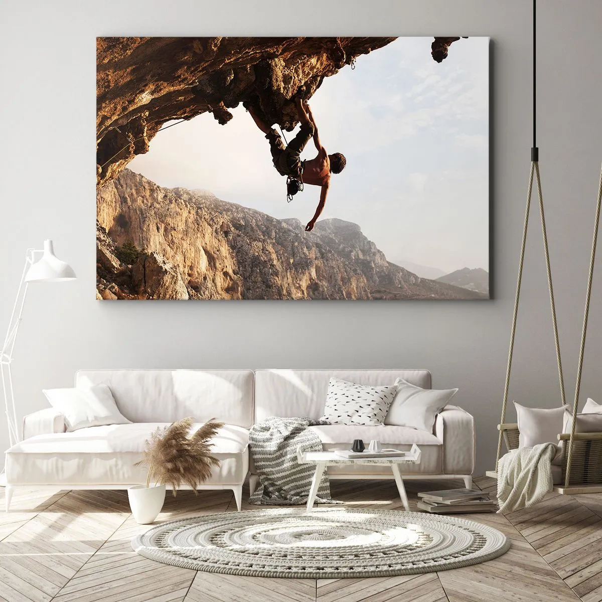 Obraz na płótnie - Wspinacz na stromym klifie w górach w promieniach słońca - 120x80cm - Świat skurczony w garści na obrywie głazu - Nowoczesna dekoracja ścienna do salonu, kuchni i sypialni ARTTOR