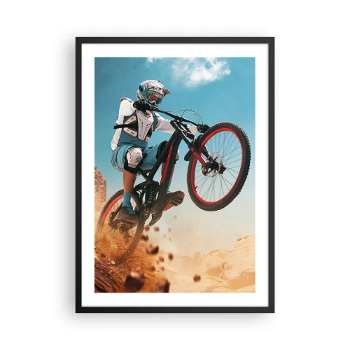 Plakat w czarnej ramie - Kolarz górski w dynamicznym skoku na tle pustynnego krajobrazu - 50x70cm - Rowerowy demon szaleństwa - Nowoczesna dekoracja ścienna do salonu i sypialni ARTTOR