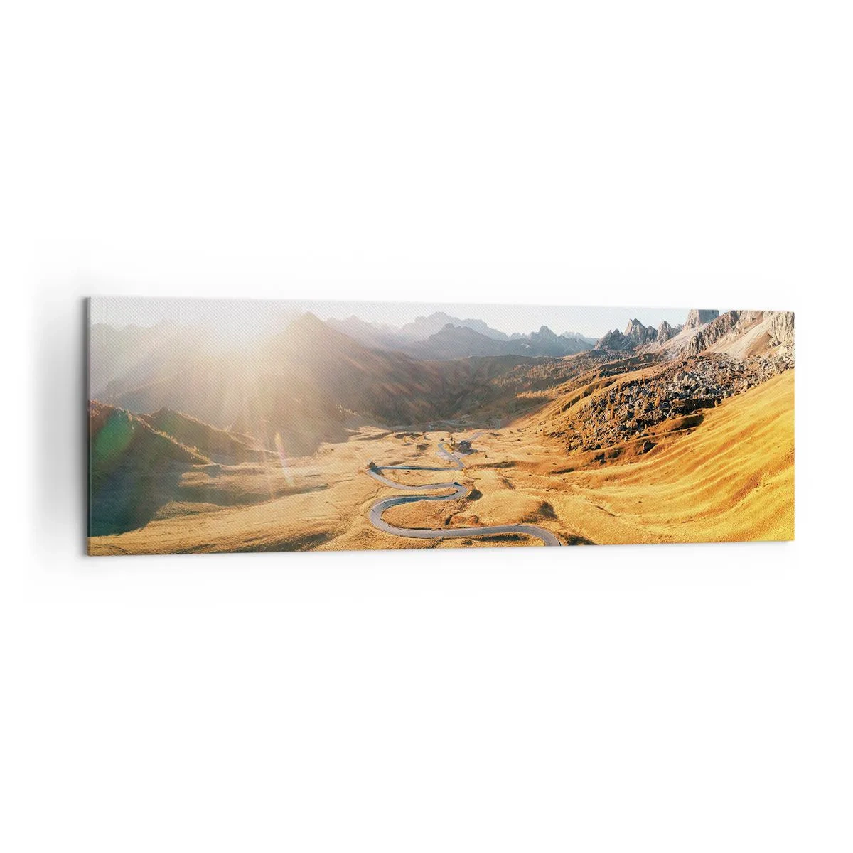 Obraz na płótnie - Kręta droga w górach oświetlona zachodzącym słońcem - 160x50cm - W złotej dolinie - Nowoczesna dekoracja ścienna do salonu i sypialni ARTTOR
