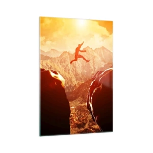 Obraz na szkle - Postać skacząca między skałami na tle gór - 70x100cm - Przekraczając granice - Nowoczesna dekoracja ścienna do salonu i sypialni ARTTOR
