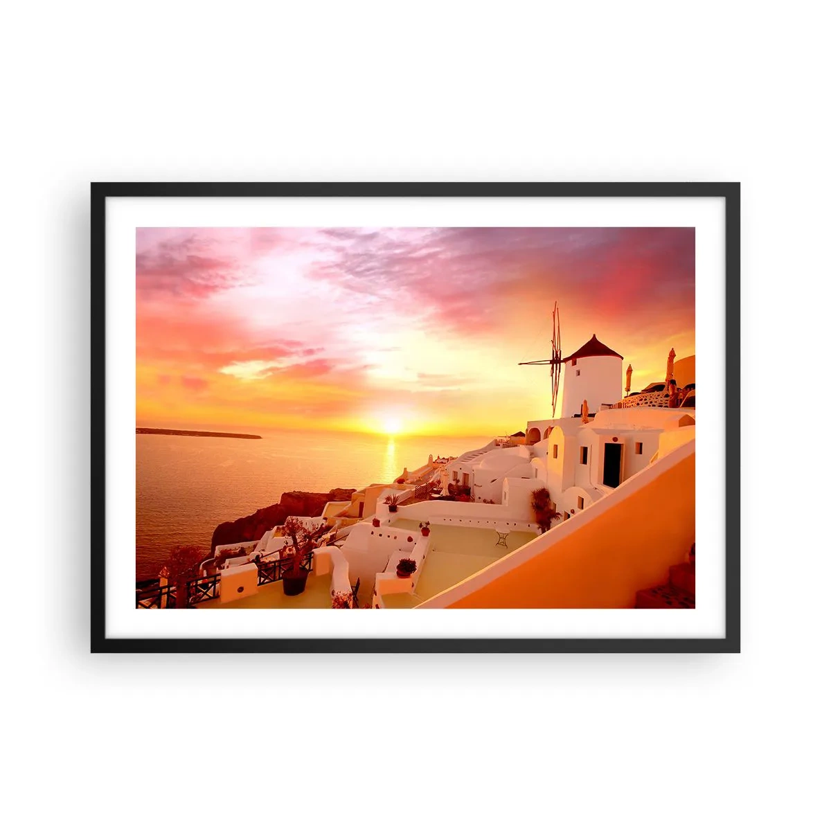 Plakat w czarnej ramie - Santorini o zachodzie słońca z wiatrakiem - 70x50cm - Rozpłynąć się w bieli i złocie - Nowoczesna dekoracja ścienna do salonu i sypialni ARTTOR