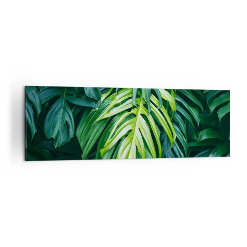 Obraz na płótnie - Zielone liście w gęstym tropikalnym układzie - 160x50cm - Zanurzyć się w świeżości - Nowoczesna dekoracja ścienna do salonu i sypialni ARTTOR