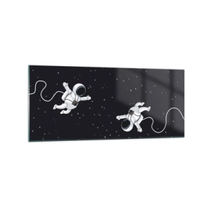 Obraz na szkle - Astronauci unoszący się w kosmosie na tle gwiazd - 120x50cm - Kosmiczny pląs - Nowoczesna dekoracja ścienna do salonu i sypialni ARTTOR