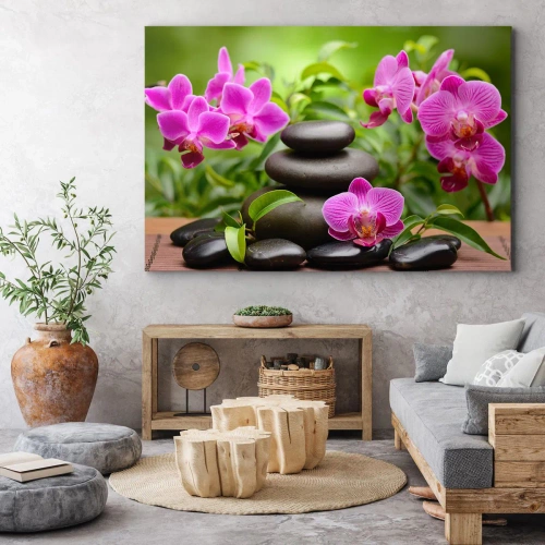 Obraz na płótnie - Piramida spokoju - Różowe orchidee z kamieniami na tle zieleni - 70x50cm
