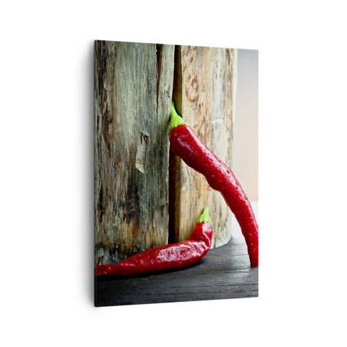 Obraz na płótnie - Dwie czerwone papryczki chili na drewnianym tle z rustykalnym akcentem - 70x100cm - Red hot chili peppers - Nowoczesna dekoracja ścienna do salonu i sypialni ARTTOR