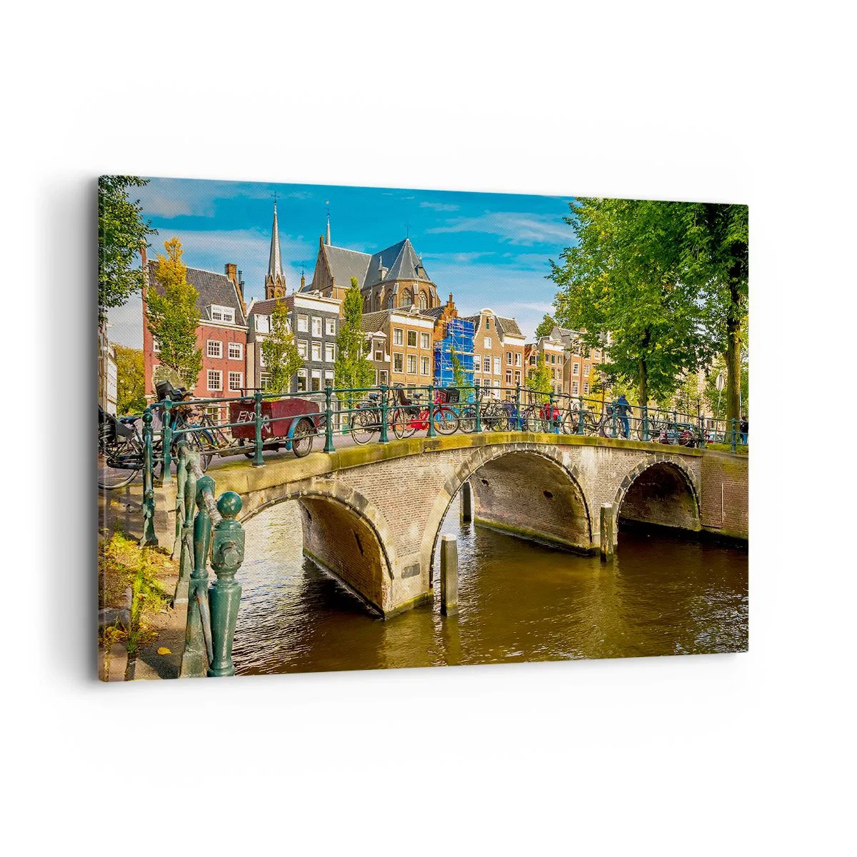 Obraz na płótnie - Malowniczy kanał z mostem w Amsterdamie - 100x70cm - Wiosna nad kanałem - Nowoczesna dekoracja ścienna do salonu, kuchni i sypialni ARTTOR