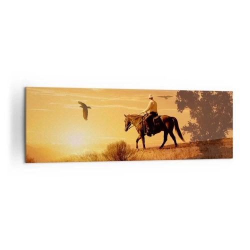 Obraz na płótnie - Jezdziec na koniu o zachodzie słońca na tle prerii - 160x50cm - Samotnie przez prerię - Nowoczesna dekoracja ścienna do salonu i sypialni ARTTOR