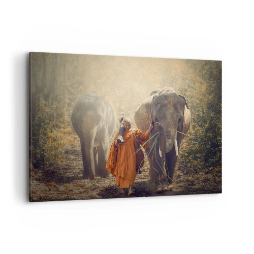 Obraz na płótnie - Mnich w pomarańczowej szacie prowadzący słonia w lesie - 100x70cm - Pełne zrozumienie - Nowoczesna dekoracja ścienna do salonu, kuchni i sypialni ARTTOR