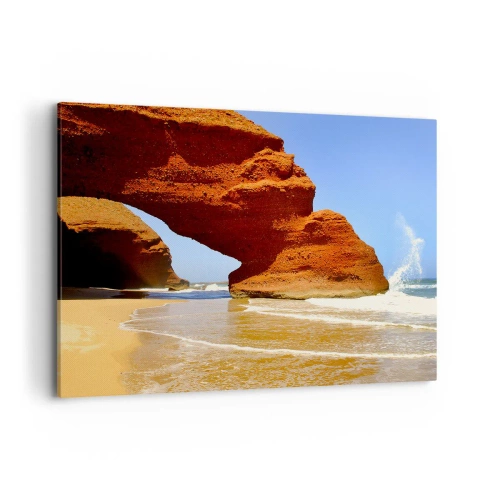 Obraz na płótnie - Naturalny łuk skalny na plaży z błękitnym niebem i falami - 100x70cm - Woda i wiatr przez tysiące lat - Nowoczesna dekoracja ścienna do salonu, kuchni i sypialni ARTTOR
