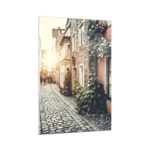 Obraz na szkle - Urokliwa uliczka z kamiennym brukiem i kwiatami - 70x100cm - Różany zaułek w różowym blasku - Nowoczesna dekoracja ścienna do salonu i sypialni ARTTOR