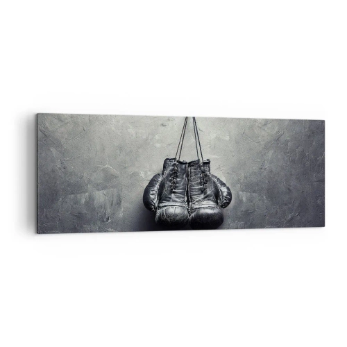 Obraz na płótnie - Stare rękawice bokserskie na tle ściany - 140x50cm - Czas walki i czas pokoju - Nowoczesna dekoracja ścienna do salonu i sypialni ARTTOR