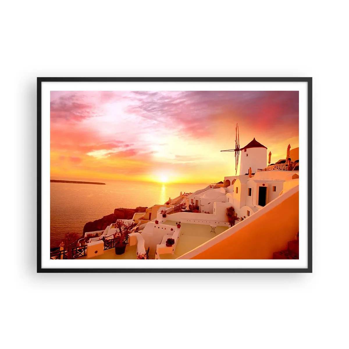 Plakat w czarnej ramie - Santorini o zachodzie słońca z wiatrakiem - 100x70cm - Rozpłynąć się w bieli i złocie - Nowoczesna dekoracja ścienna do salonu i sypialni ARTTOR