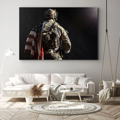 Obraz na płótnie - Właśnie dlatego - Żołnierz w mundurze z flagą na tle ciemności - 70x50cm